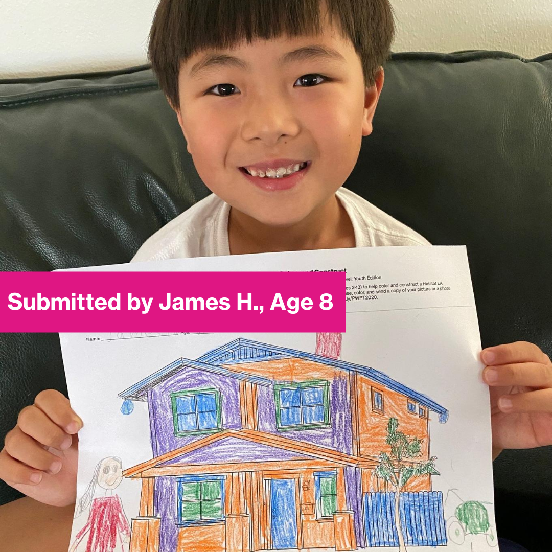 Child contestant holding his drawing.